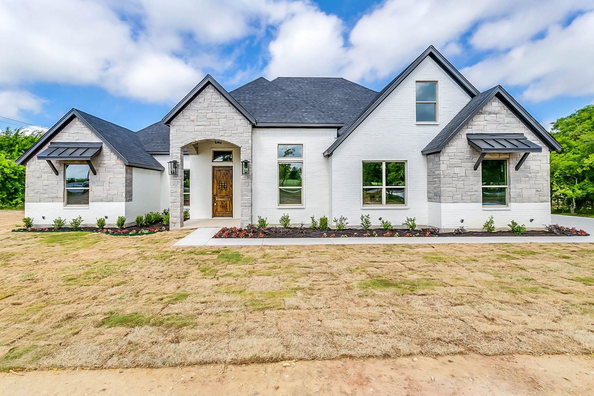 Custom Taylor Home exterior at dusk in North Texas