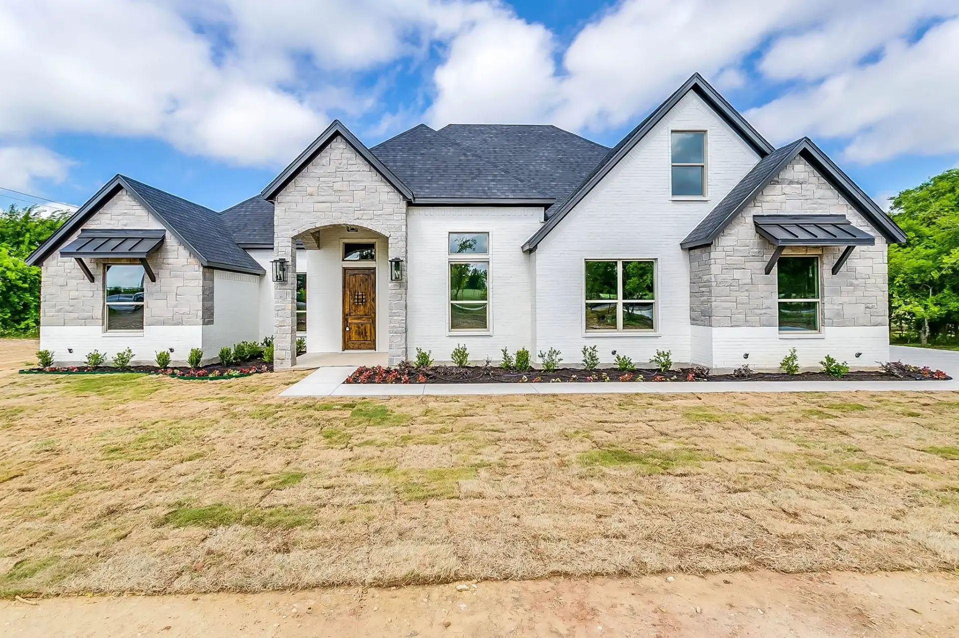 Custom Taylor Home exterior at dusk in North Texas